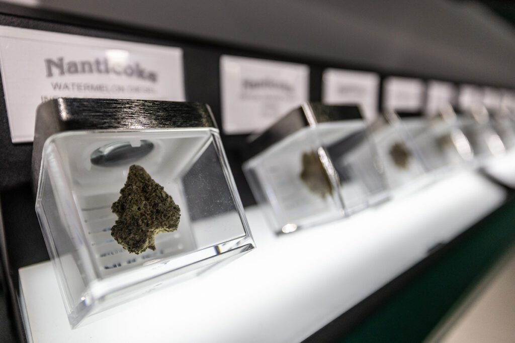 A row of flower products on display at Token Dispensary