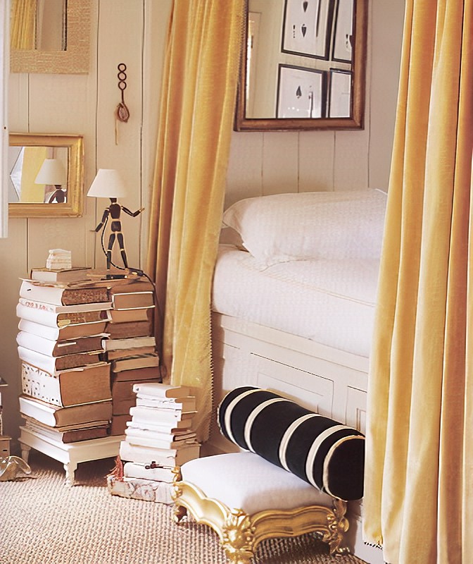 A bedroom filled with books